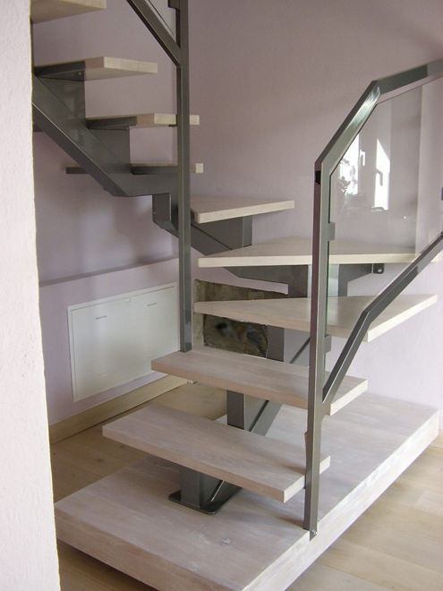 modern style ladder with iron steps and glass parapet